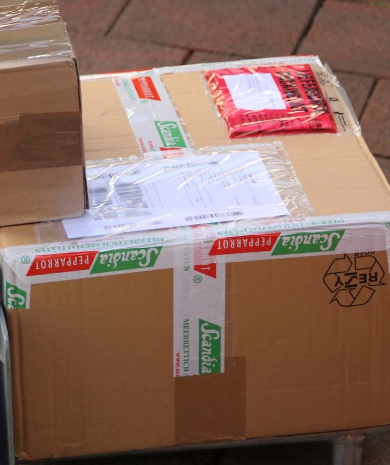 Shipping boxes with thermal labels ready for courier and logistics dispatch