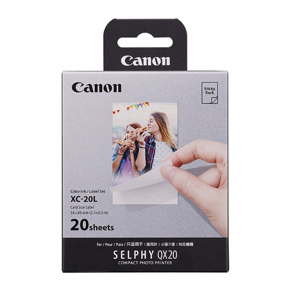 Canon Selphy photo paper packaging with a hand holding a printed photo.