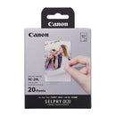 Canon Selphy photo paper packaging with a hand holding a printed photo.